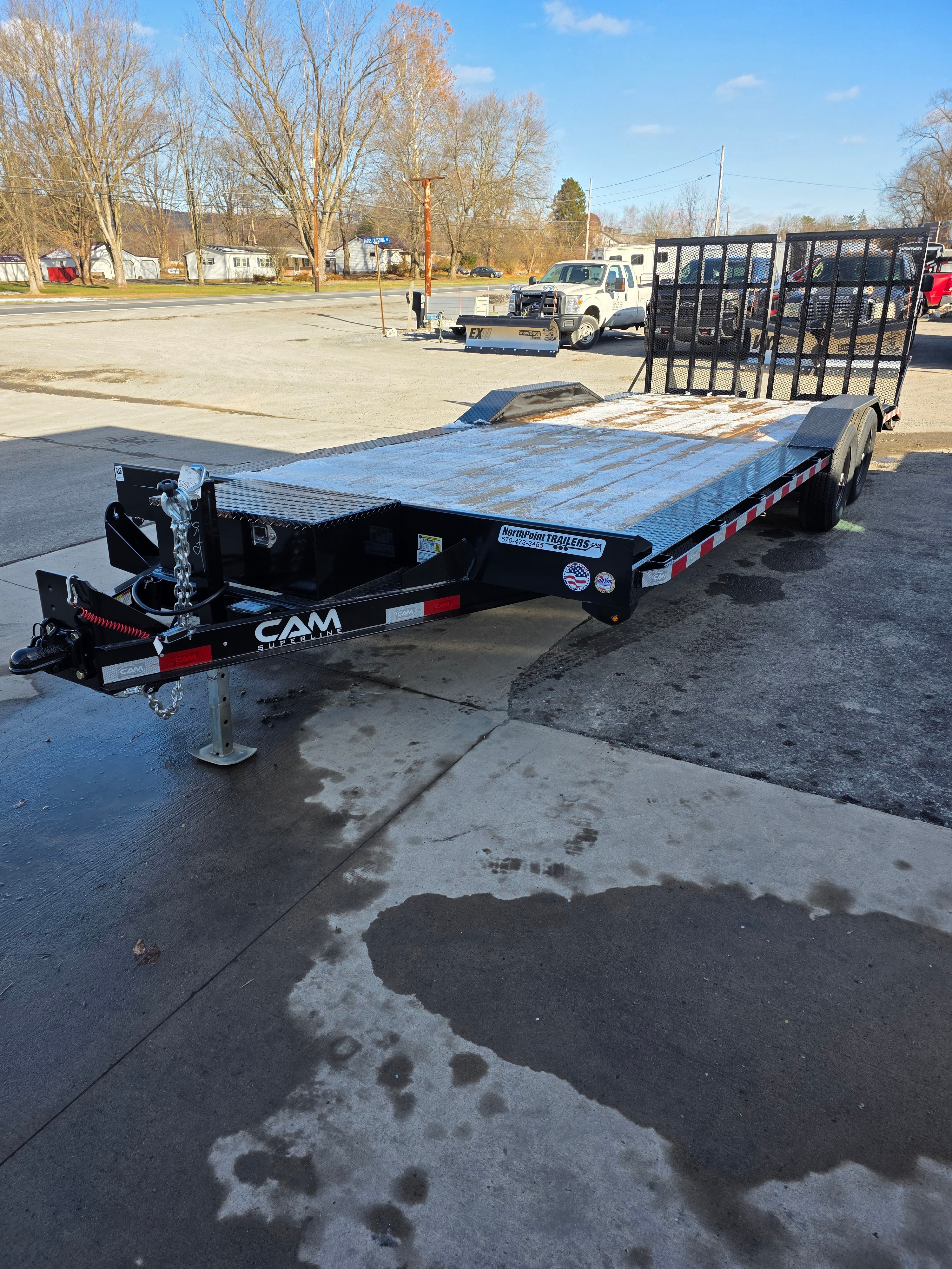 8x22 car hauler and equipment trailer with CAM Superline branding showing wide deck with drive-over fenders